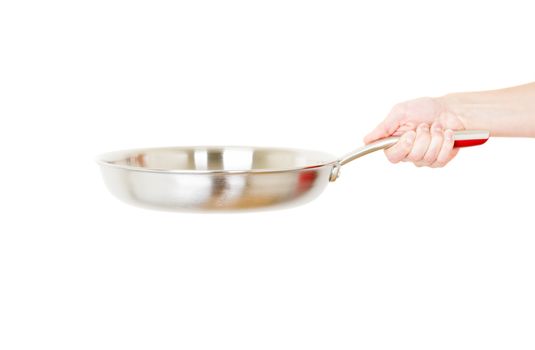 Steel frying pan hold by hand isolated on white background