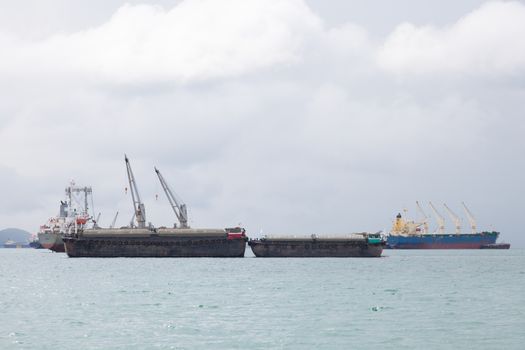 Cargo ship. Parking in the sea to await transportation to the port.