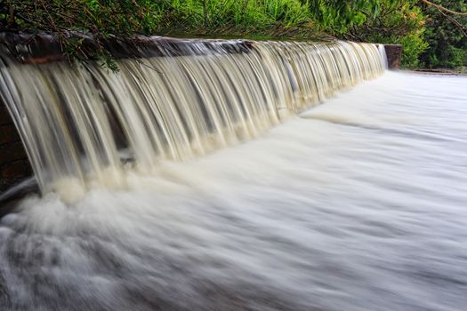 Water flows over the weir at Coote Creek Wattamolla, Royal National Park, Australia