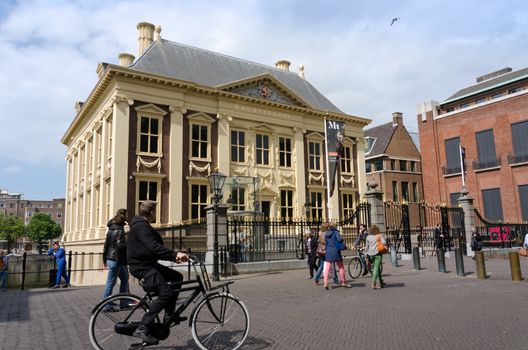 The Hague, Netherlands - May 8, 2015: Tourists visit Mauritshuis Museum in The Hague, Netherlands.The museum houses the Royal Cabinet of Paintings which consists of 841 objects, mostly Dutch Golden Age paintings.