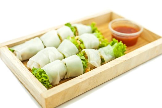 Rice paper wrapped vegetable with vermicelli noodles and a thai peanut sauce