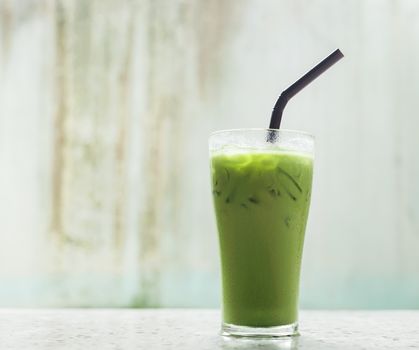 Ice milk green tea, famous drink in Thailand, Grunge background