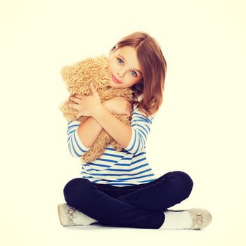 childhood, toys and shopping concept - cute little girl hugging teddy bear