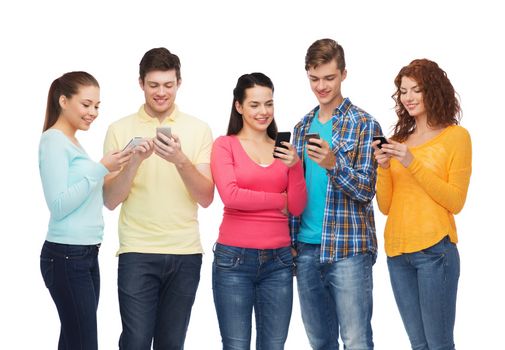 friendship, technology and people concept - group of smiling teenagers with smartphones