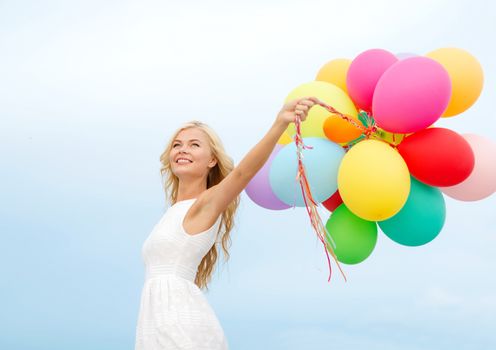 summer holidays, celebration and lifestyle concept - beautiful woman with colorful balloons outside