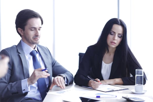 Business people discussing financial reports during a meeting