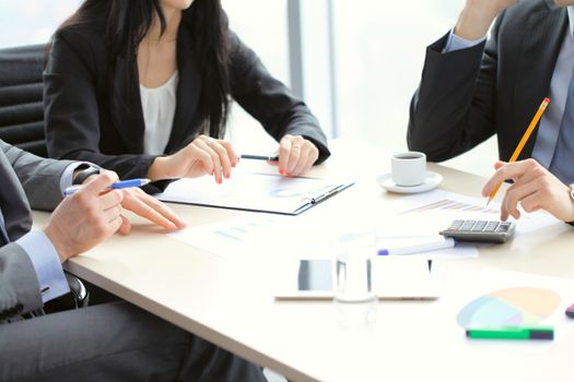 Business people discussing financial reports during a meeting