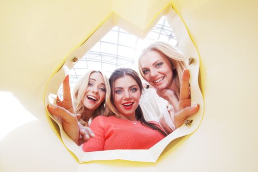 beautiful young women looking inside bag