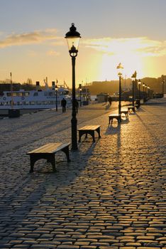 Stockholms embankment with a lamps.