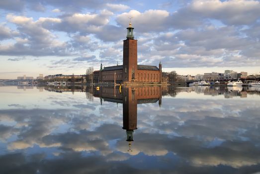 Stockholm City Hall with reflection on water.