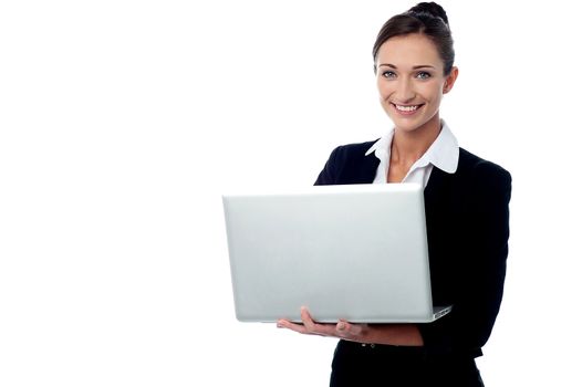 Smiling business woman working with laptop