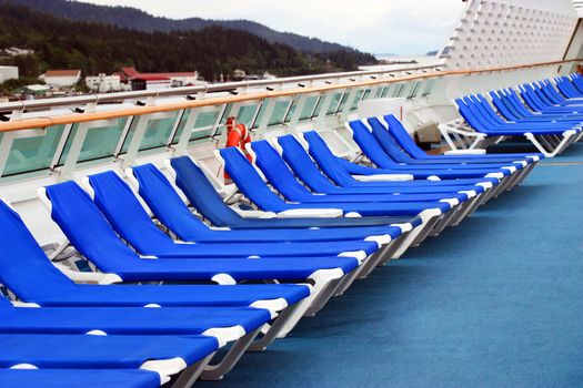 Row of beach chairs on cruise ship deck