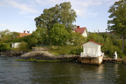 Idyllic houses by the baltic sea with jetties in a spring setting