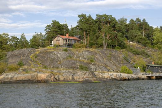 Idyllic houses by the baltic sea with jetties in a spring setting