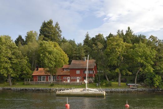 Idyllic houses by the baltic sea with jetties in a spring setting