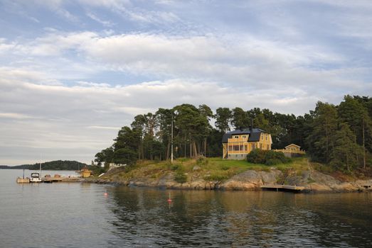 Idyllic houses by the baltic sea with jetties in a spring setting