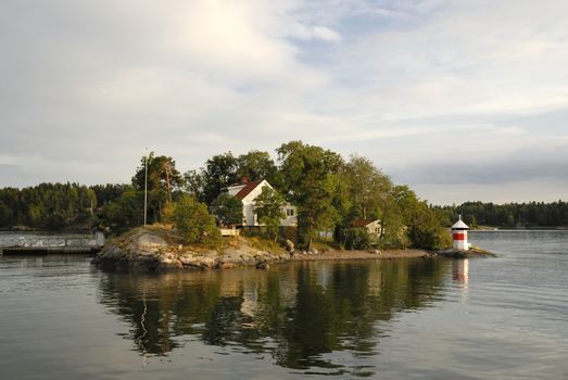Idyllic houses by the baltic sea with jetties in a spring setting