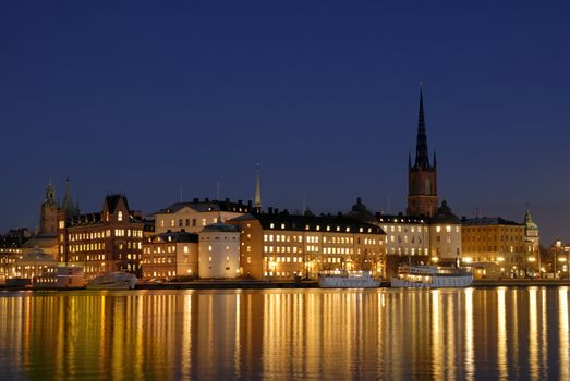 Stockholm embankment with boats at night.