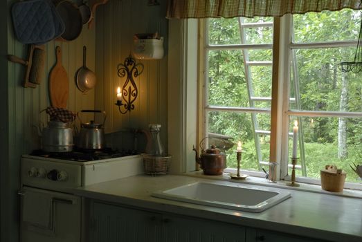 Old Swedish kitchen, kettle on a stove.