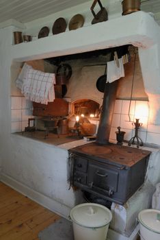 Old Swedish kitchen, kettle on a stove.