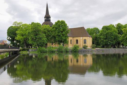 View over Fors church and the water (Eskilstuna river) flowing through the city of Eskilstuna in Södermanland, Sweden.