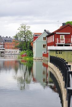 View over the water (Eskilstuna river) flowing through the city of Eskilstuna in Södermanland, Sweden.