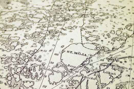 Macro shot of a very old marine chart, detailing Stockholm archipelago with the island "St.Möja" in focus.