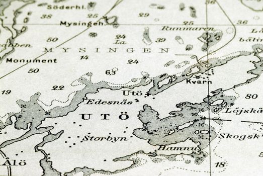 Macro shot of a very old marine chart, detailing Stockholm archipelago with the island "Utö" in focus.