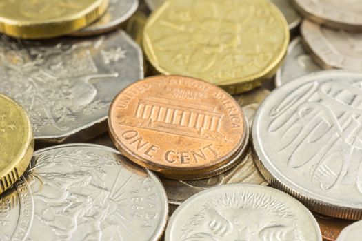 Close up money and world coins focus on one cent coin of United states of america.