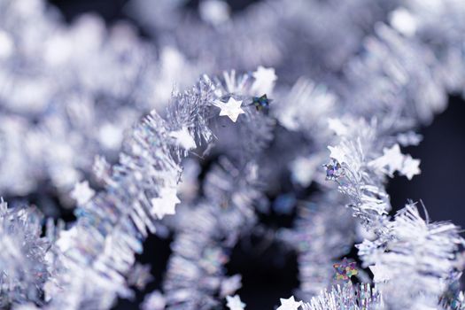 Silver tinsel Christmas decoration - close-up photo