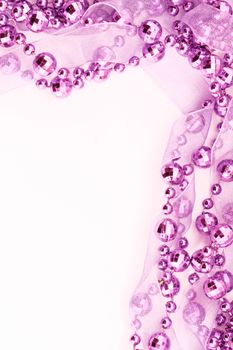 Close up of pink garland.  Light background.
