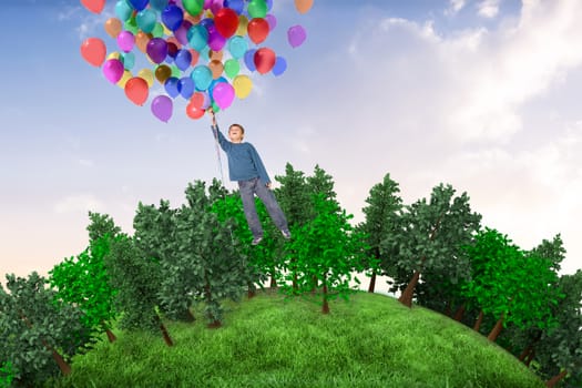 Cute boy holding balloons against beautiful orange and blue sky