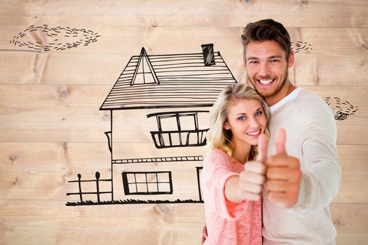 Attractive couple showing thumbs up to camera against bleached wooden planks background