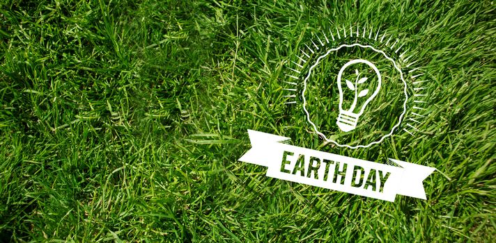 Earth Day Graphic against grass background