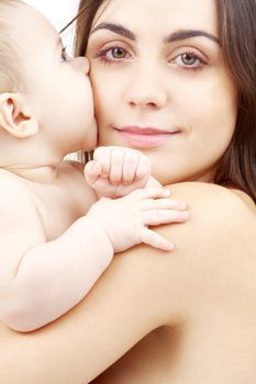 family, child and parenthood concept - happy mother with smiling baby