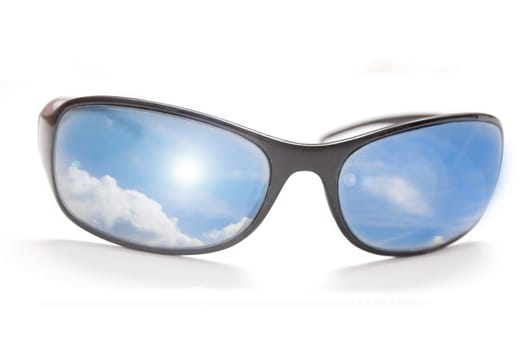 Sunglasses with sky in glass.