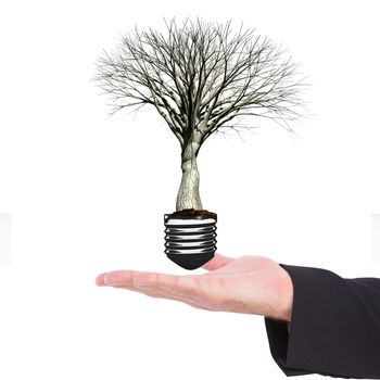 Businessman holding hand out in presentation against empty light bulb