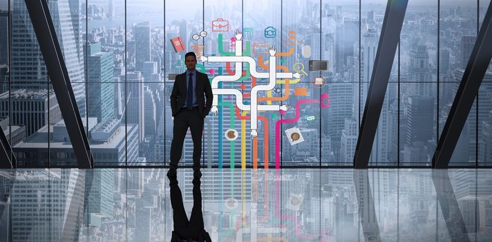 Businessman standing against room with large window looking on city