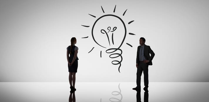 Businesswoman standing against white background with vignette