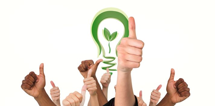Hands showing thumbs up against green energy