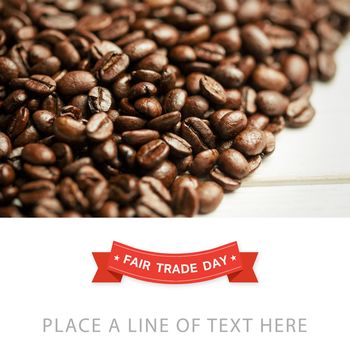 Fair Trade graphic against coffee beans