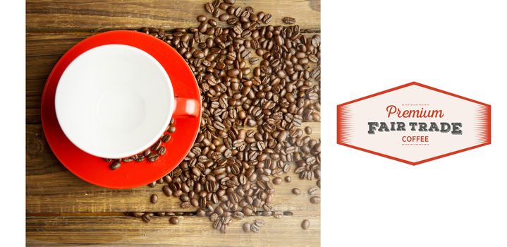 Fair Trade graphic against coffee beans and cup