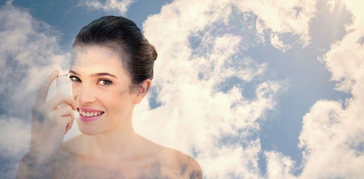Bright blue sky with clouds against gorgeous natural brown haired model using an asthma inhaler