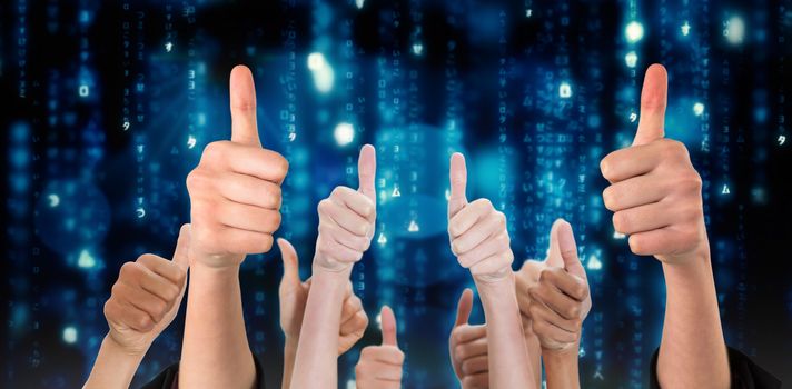 Hands showing thumbs up against digitally generated black and blue matrix