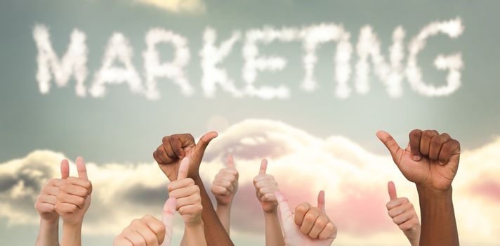 Hands giving thumbs up  against clouds spelling out marketing