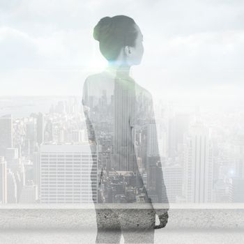 Unsmiling asian businesswoman against cityscape