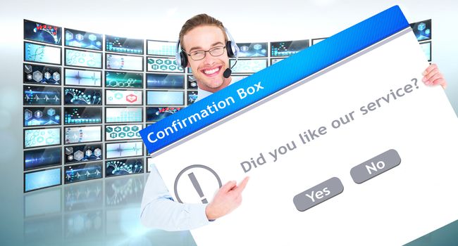 Businessman showing card wearing headset against confirmation box