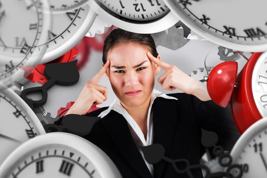 Stressed businesswoman with hands on her head against grey background