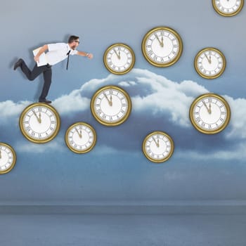 Geeky young businessman running late against clouds in a room