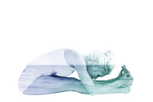 Toned woman doing the paschimottanasana pose against beach scene